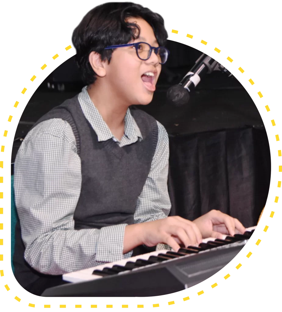 A student of Primary Years Programme from Sekolah Victory Plus - The leading International Baccalaureate School in Indonesia is playing a keyboard