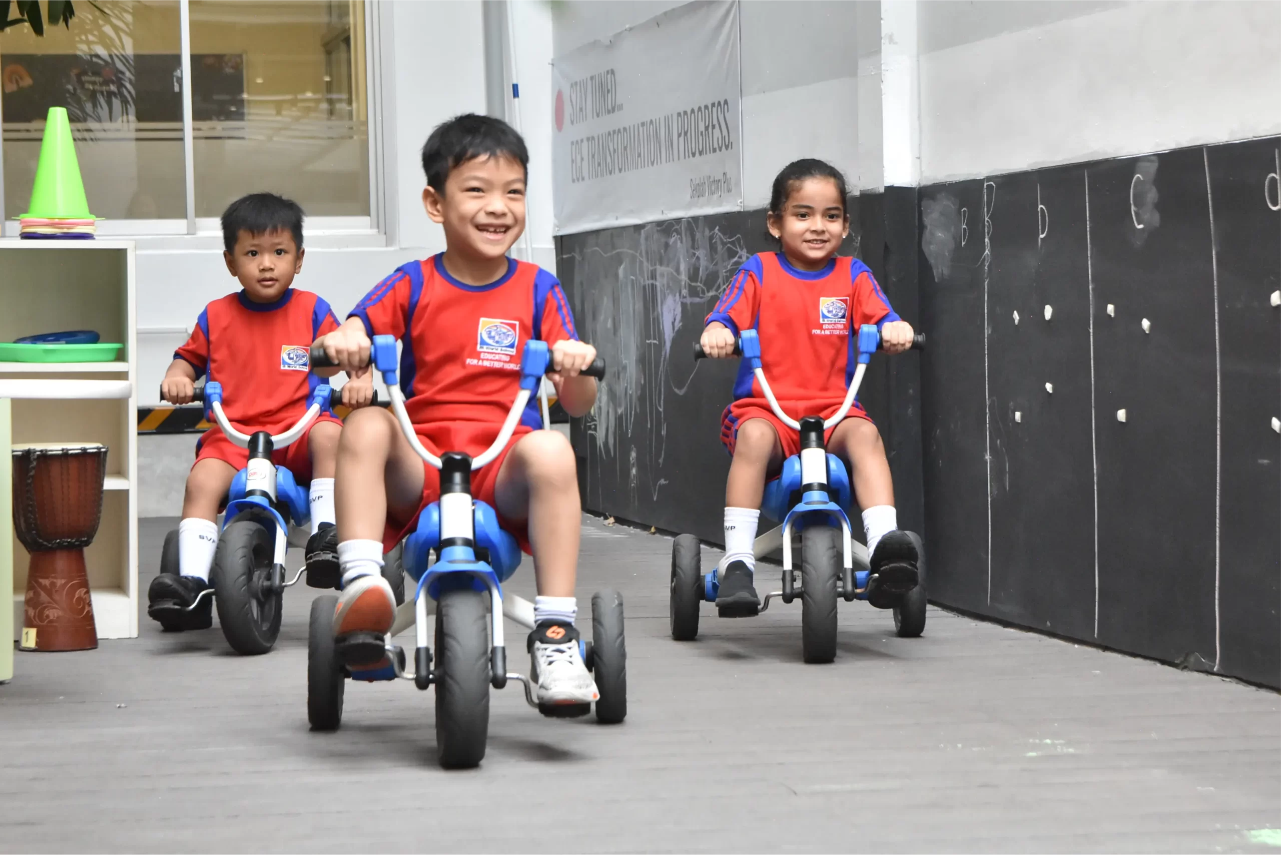 Three students of Early Childhood Education Programme from Sekolah Victory Plus - The Innovative International Baccalaureate School in Indonesia are riding bicycles at my city area