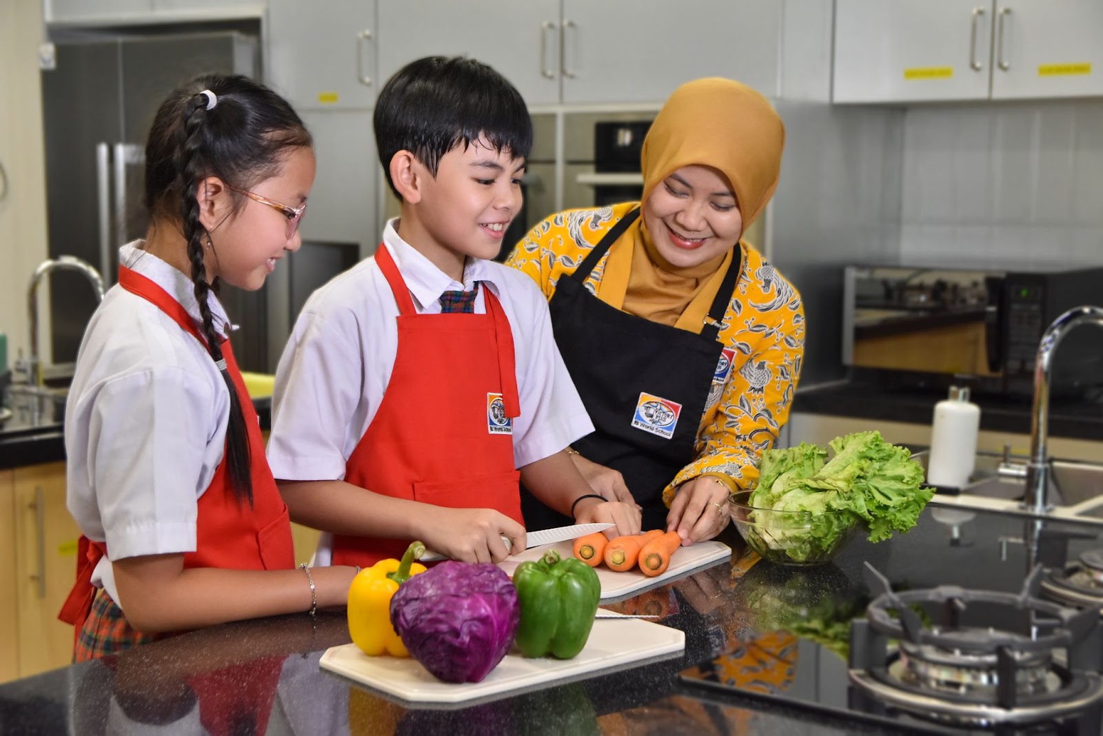 Two students and one teacher of Sekolah Victory Plus - the leading International Baccalaureate School in Indonesia are practising doing their house chores